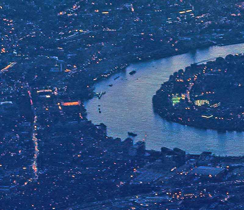 Greenwich Aerial shot at night of the Thames and the town.