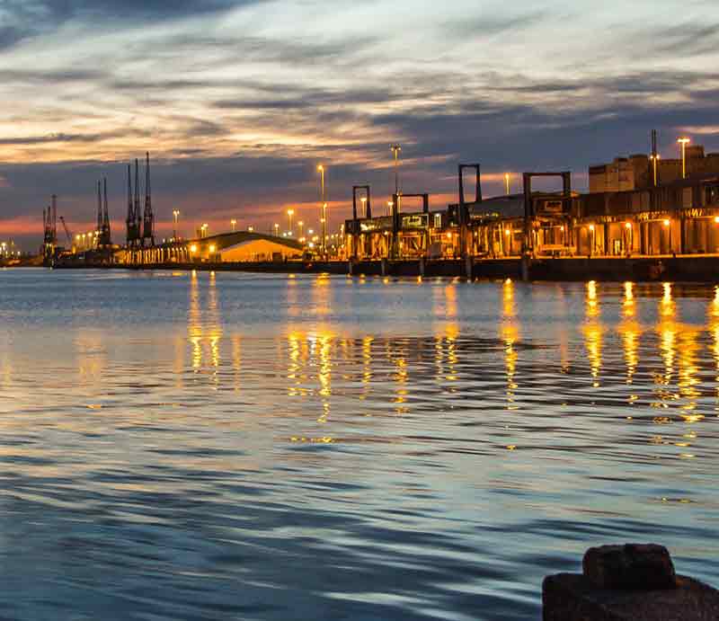 Southampton The port lit up at night across the water.