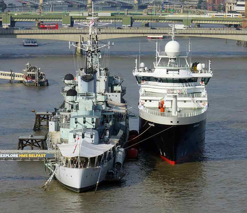 Tower Bridge Upper Mooring HMS Belfast with modern cruise ship docked next to it.